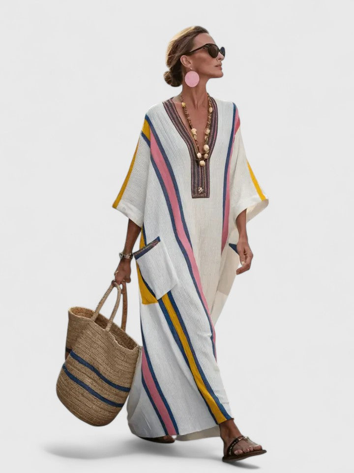 Women's striped kaftan maxi dress showing three-quarter sleeve with ribbed cuff detail