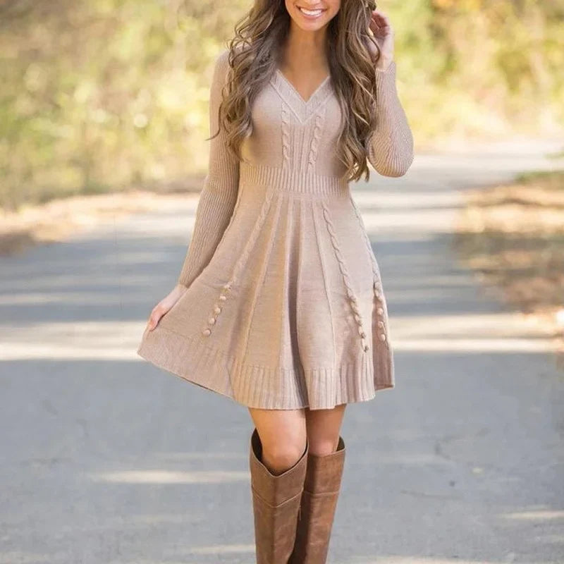 V neck ribbed waist knitted jumper dress with a flowing skirt