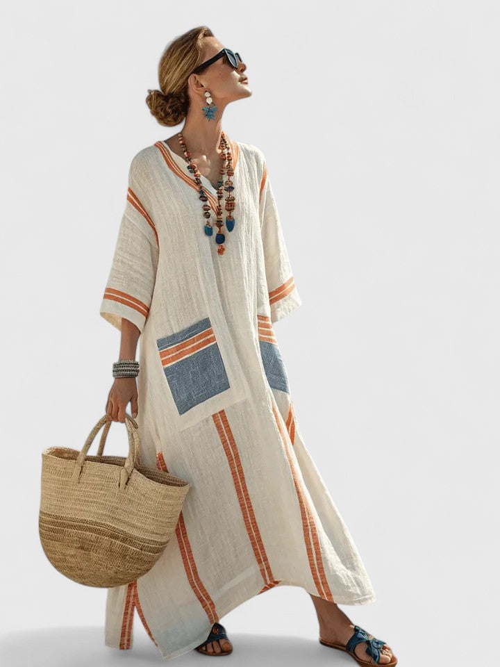 Women's V-neck kaftan maxi dress styled for a summer holiday beach outing