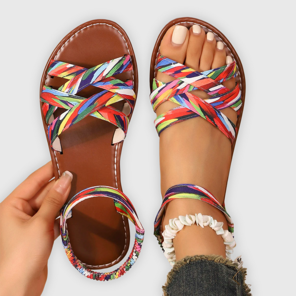 Women's handwoven criss-cross strap summer sandals in natural tan, front view