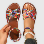 Women's handwoven criss-cross strap summer sandals in natural tan, front view