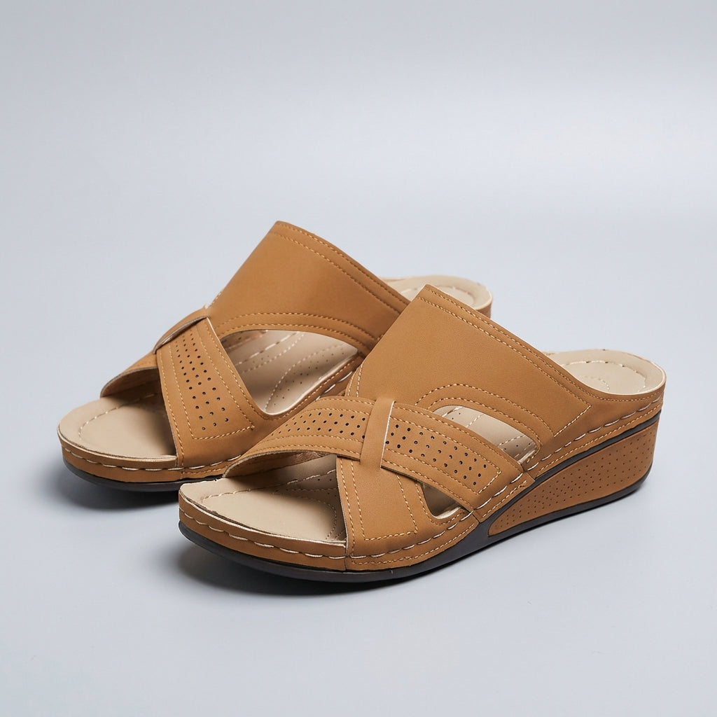 Women's slip-on wedge sandals with artistic cutout strap design – heel detail