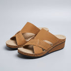 Women's slip-on wedge sandals with artistic cutout strap design – heel detail