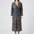 Women's botanical print midi dress detail showing knot front and V-neckline