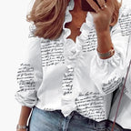 Women's V-neck ruffle detail blouse styled with skirt, three-quarter view