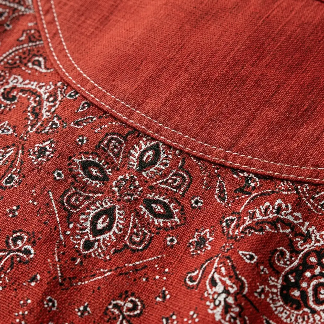 Women's long sleeve woven shirt showing refined collar detail, close-up