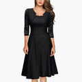 Lace sleeve flared A-line wedding guest midi dress in black, elegant front view