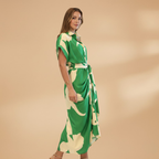 Close-up of tie waist detail on women's collared midi dress