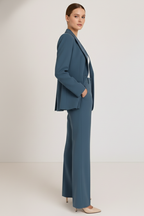 Blue two-piece trouser suit – blazer and straight leg trousers side view