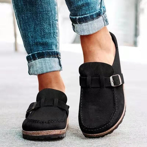 Casual buckle slip-on loafers in black, front view on white background