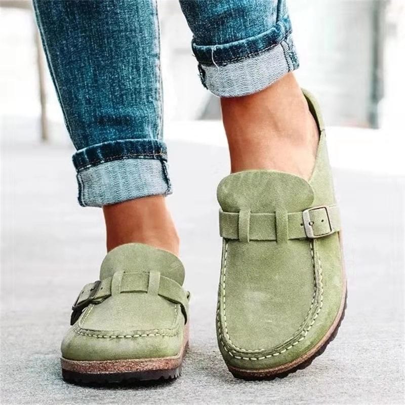 Side view of women's buckle accent slip-on loafers