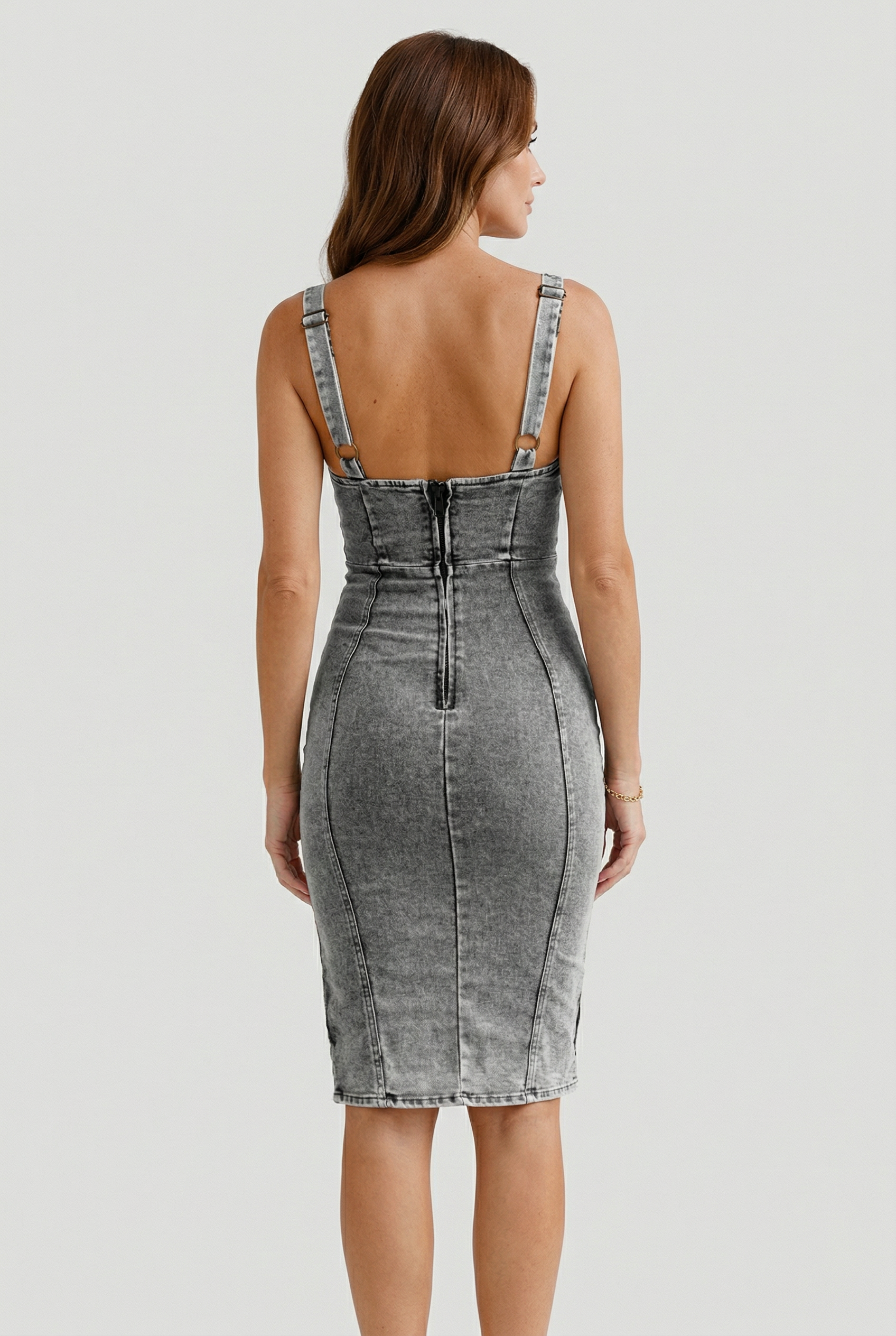 Women's denim midi dress with shoulder straps, side view