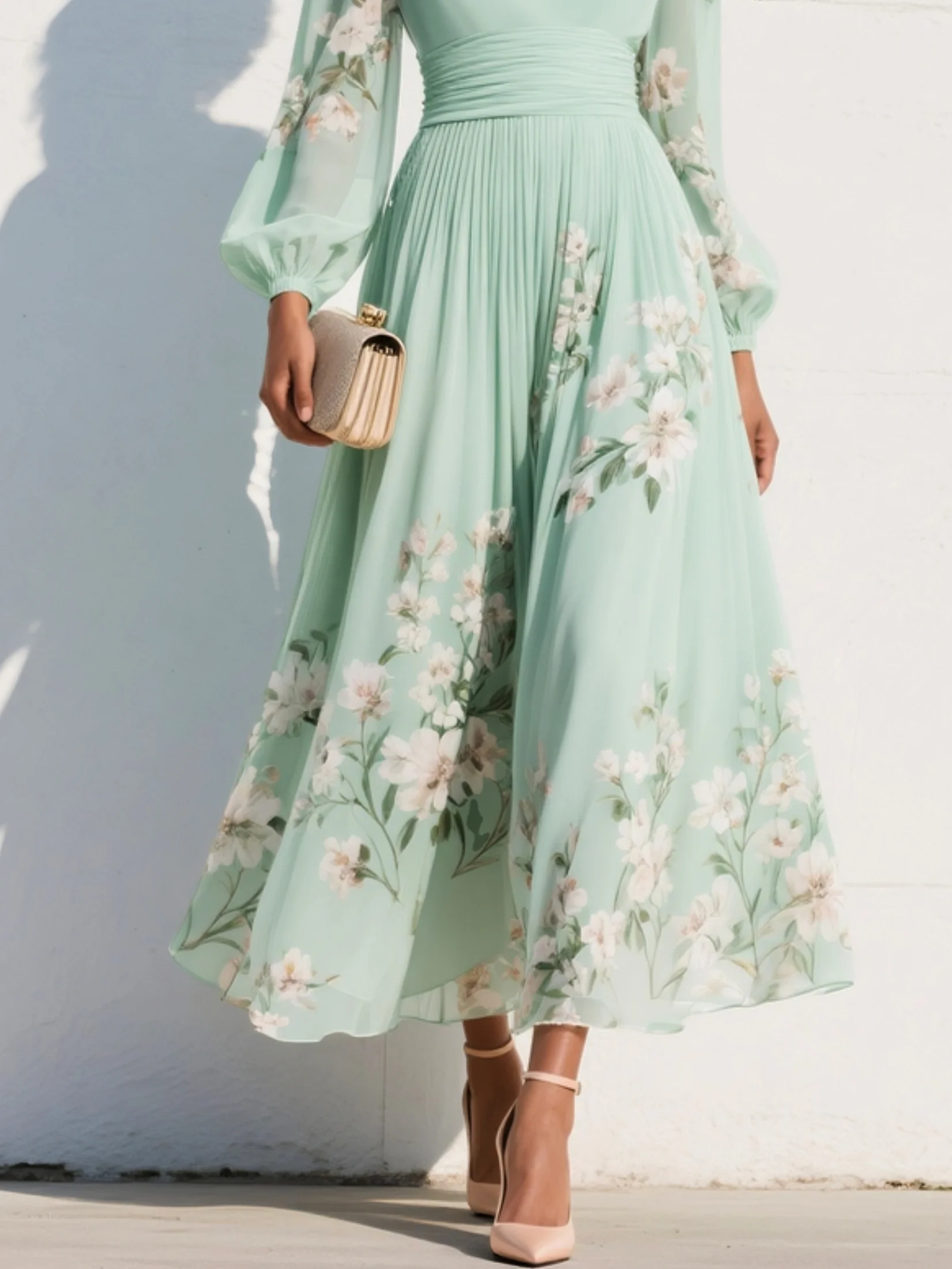 Women's floral pleated midi dress in light green – skirt close up view
