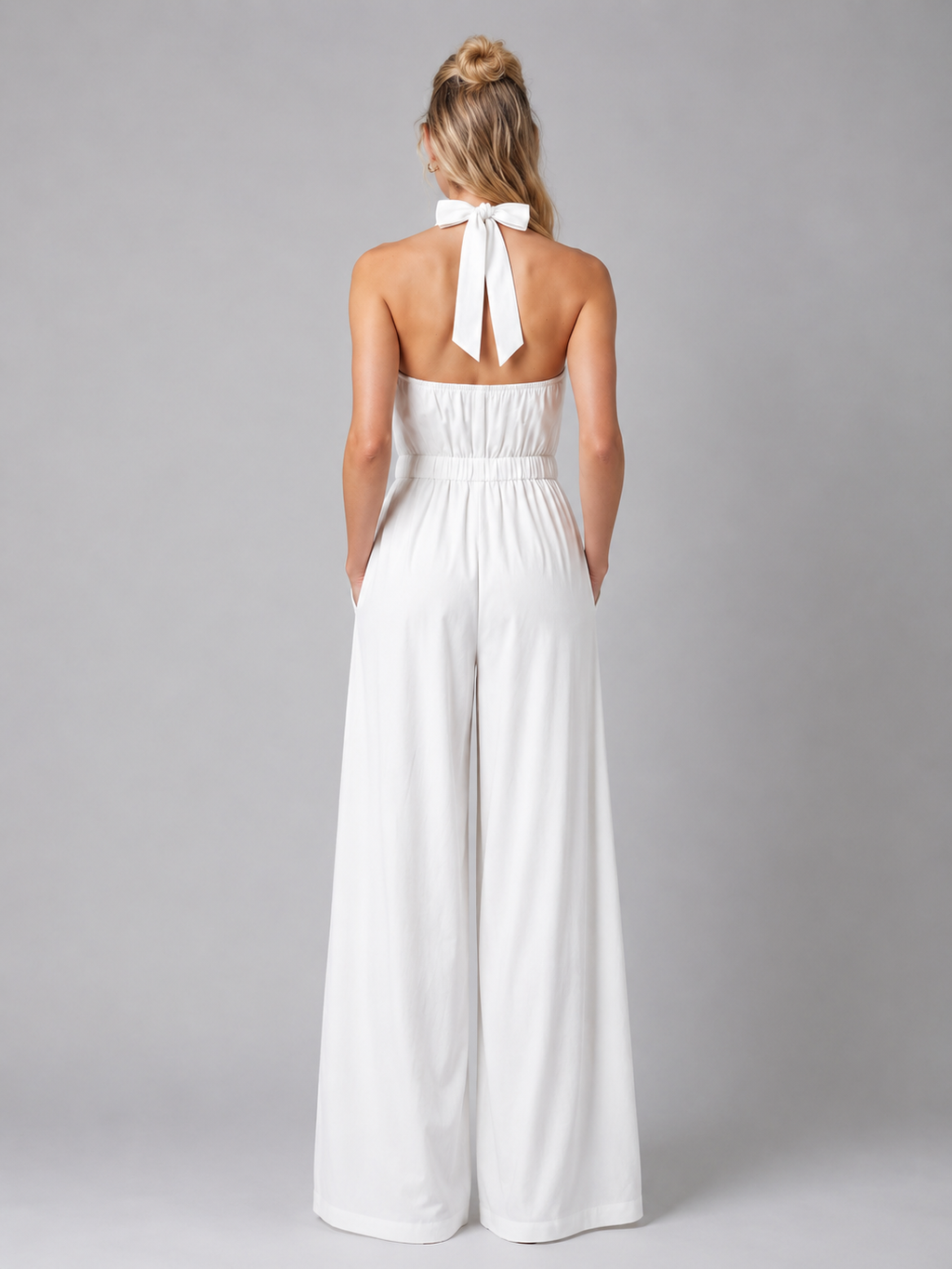 Halter neck jumpsuit side profile flowing wide leg