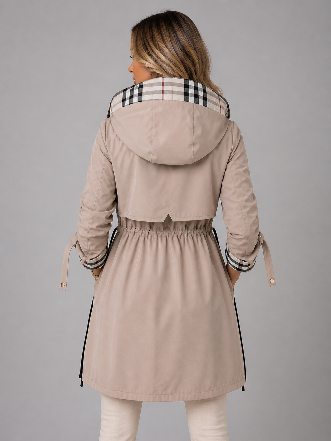 Hooded longline drawstring rain coat with an adjustable drawstring waist