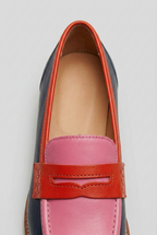 Women's two-tone loafers, close-up of penny strap detail