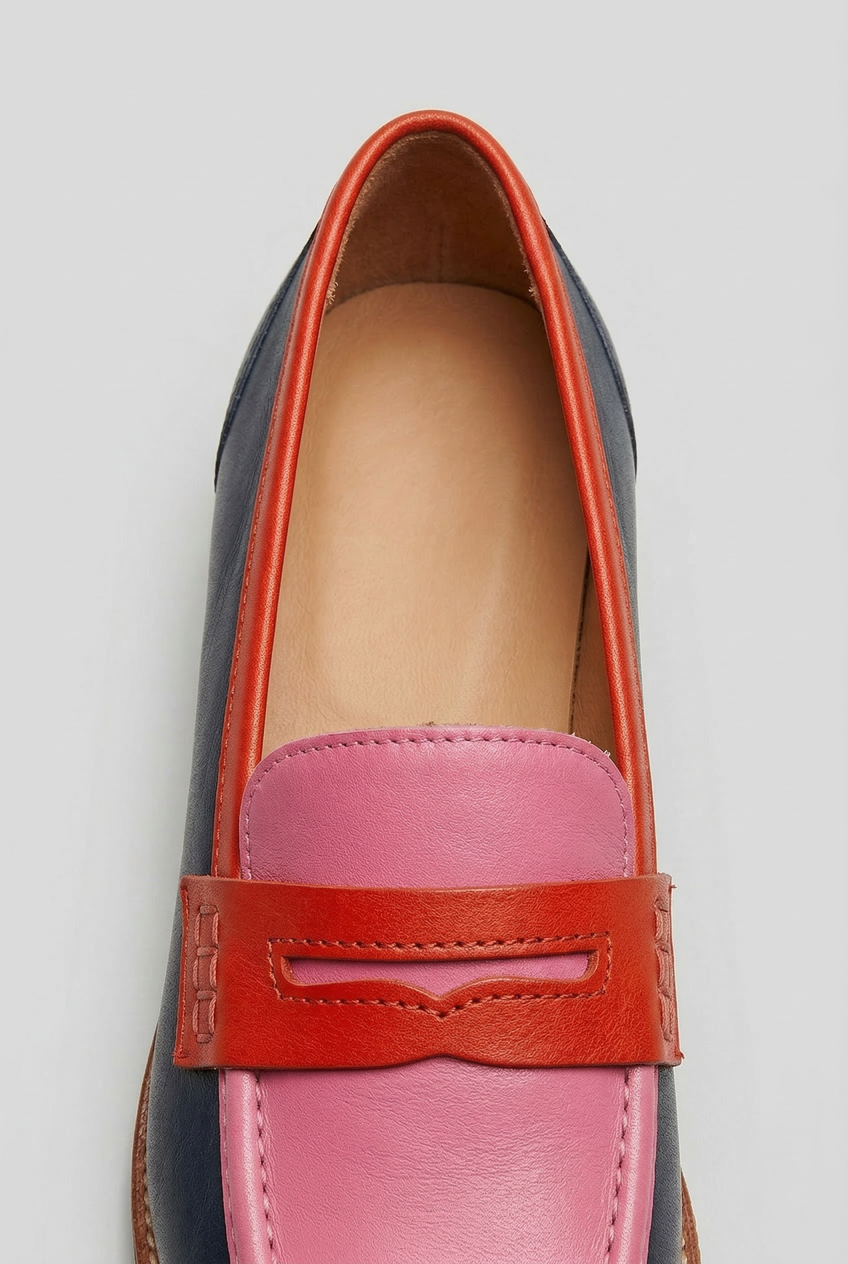 Women's two-tone loafers, close-up of penny strap detail