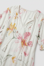 Women's boho maxi dress, close-up of tie-neck tassel detail