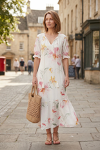 Women's flowing boho print maxi dress, back view