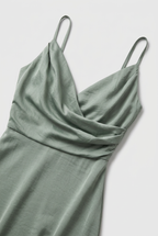 Women's sleeveless maxi dress side view showing high slit