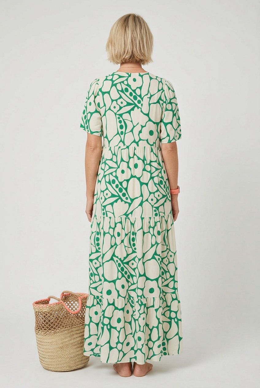 Women's V-neck printed midi dress, side view showing silhouette