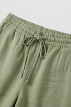Women's high waist linen-look trousers, close-up of drawstring waist detail