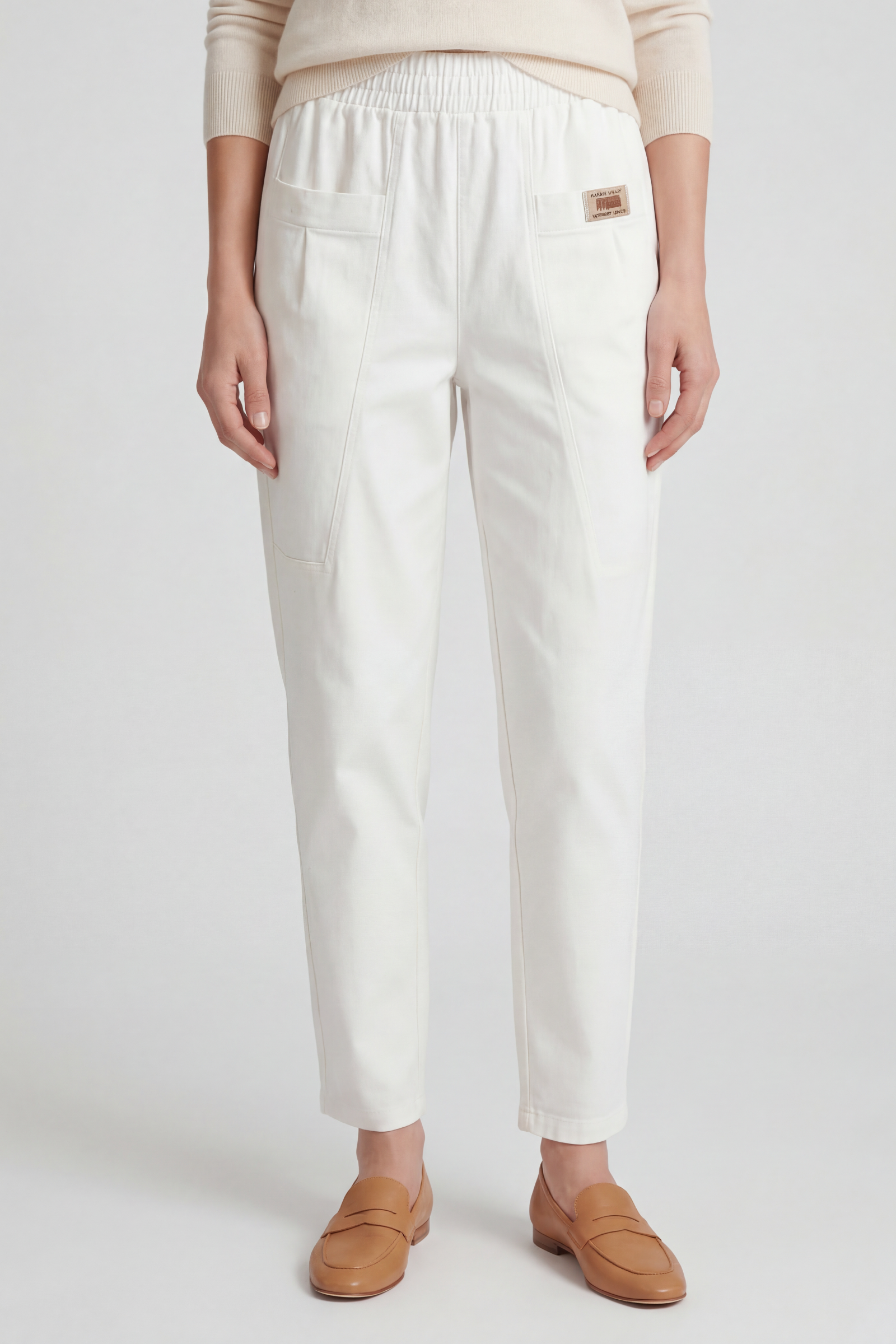 Straight-leg trousers with elasticated waist in white, front view