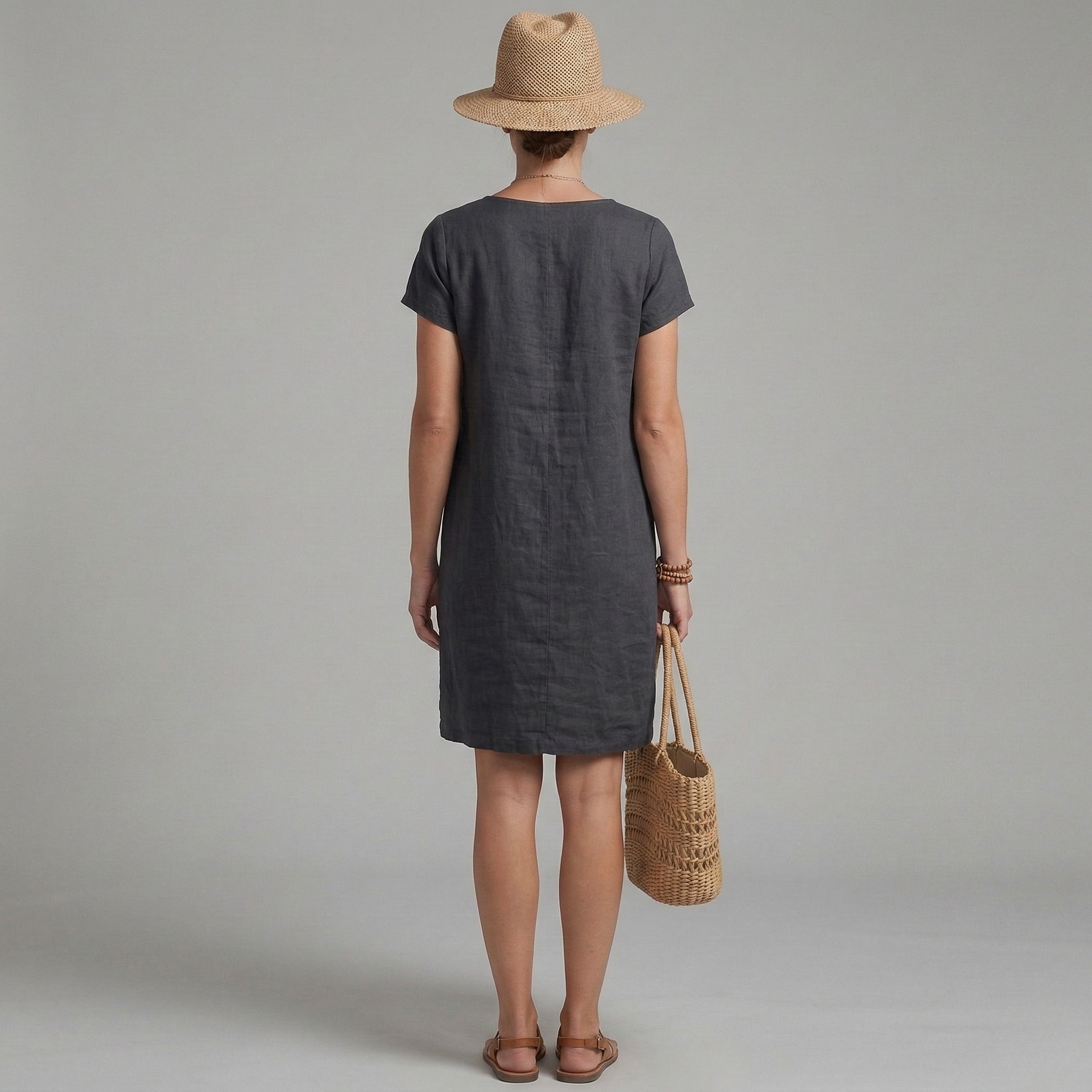 Casual summer linen mini dress with short sleeves and pockets, side view