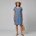 Breathable linen mini dress with round neckline and patch pockets, three-quarter view