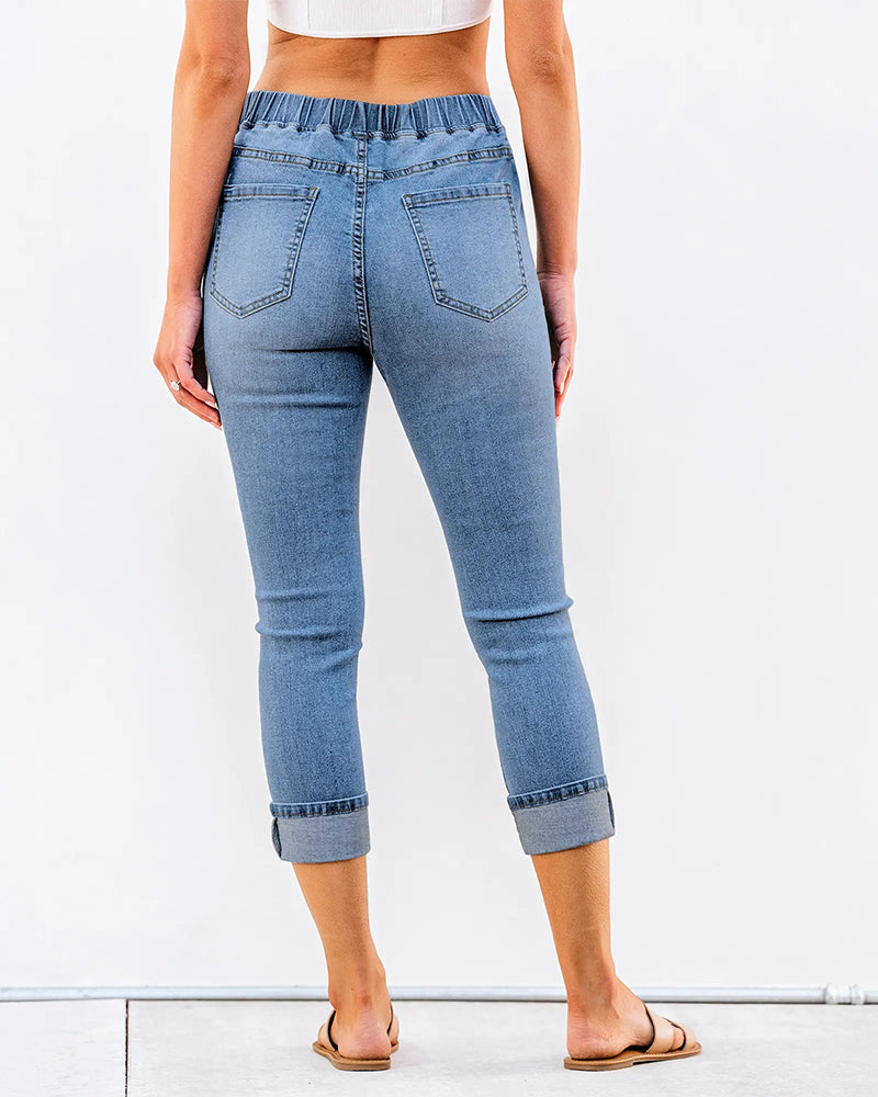 Blue elastic waist capri jeans, back view