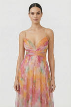 Women's chiffon pleated maxi dress, side view showing flowing skirt