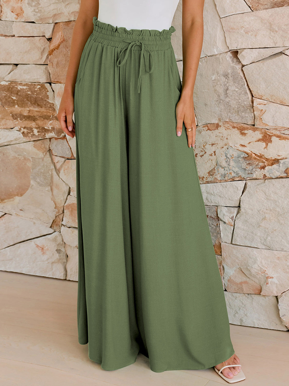 Women's drawstring wide leg pants with pockets, side profile view