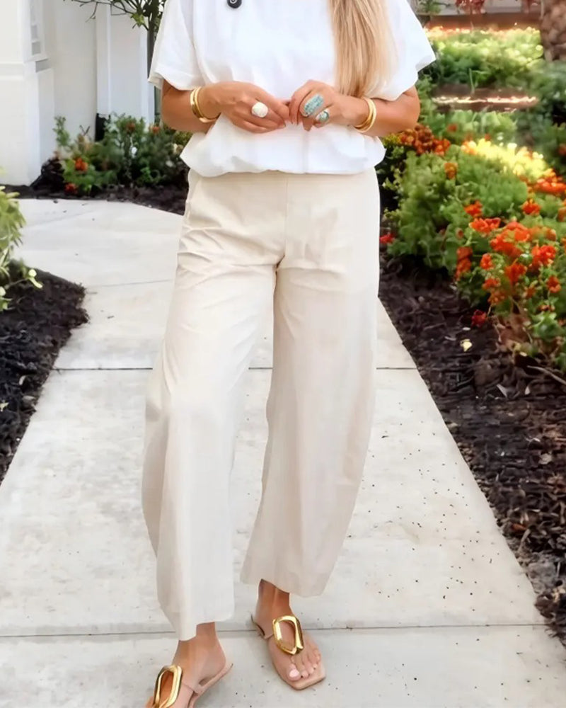 Solid colour straight leg cropped trousers, side view
