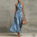 Green floral halter neck maxi dress flowing silhouette, full length view