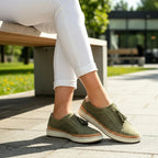 Women's perforated slip-on shoes in green – outdoor side view