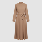 Women's long pleated dress detail showing belt and pleated skirt