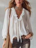 White ruffle long sleeve blouse, front view