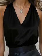 Women's deep V-neck satin camisole blouse, full-length styled view