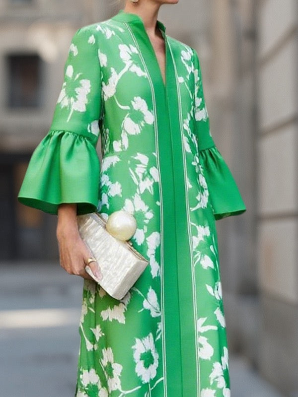 Close-up of flared bell sleeve and V-neckline on green floral print maxi dress