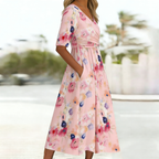 Pink floral midi dress side view showing flowing silhouette