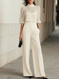 White high-neck puff sleeve jumpsuit, front view