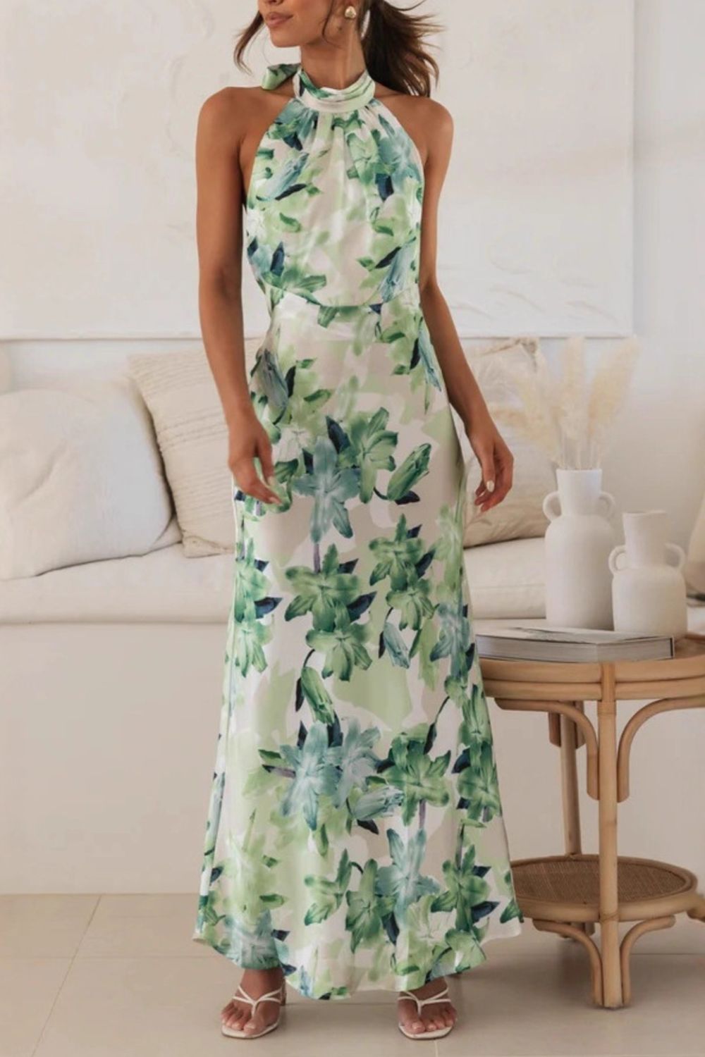 Women's floral print halter neck maxi dress, full length flowing silhouette