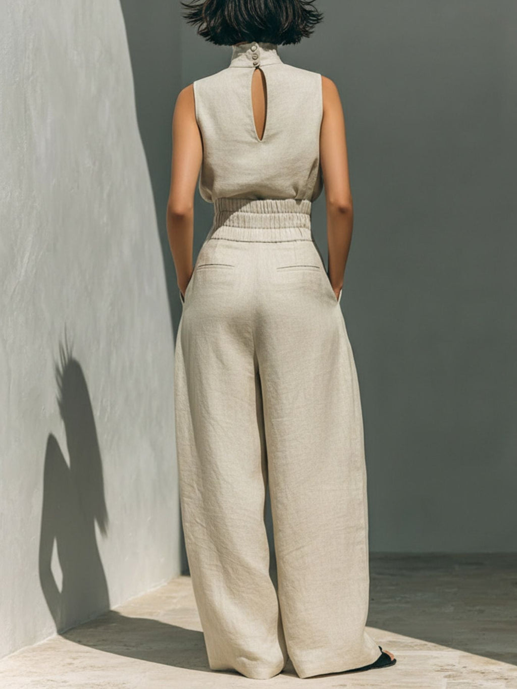 Turtleneck sleeveless co-ord set with wide leg trousers, side view