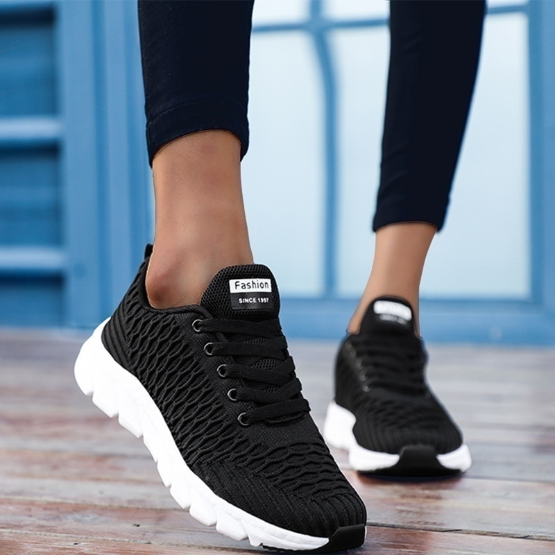 White trainers side profile view cushioned sole