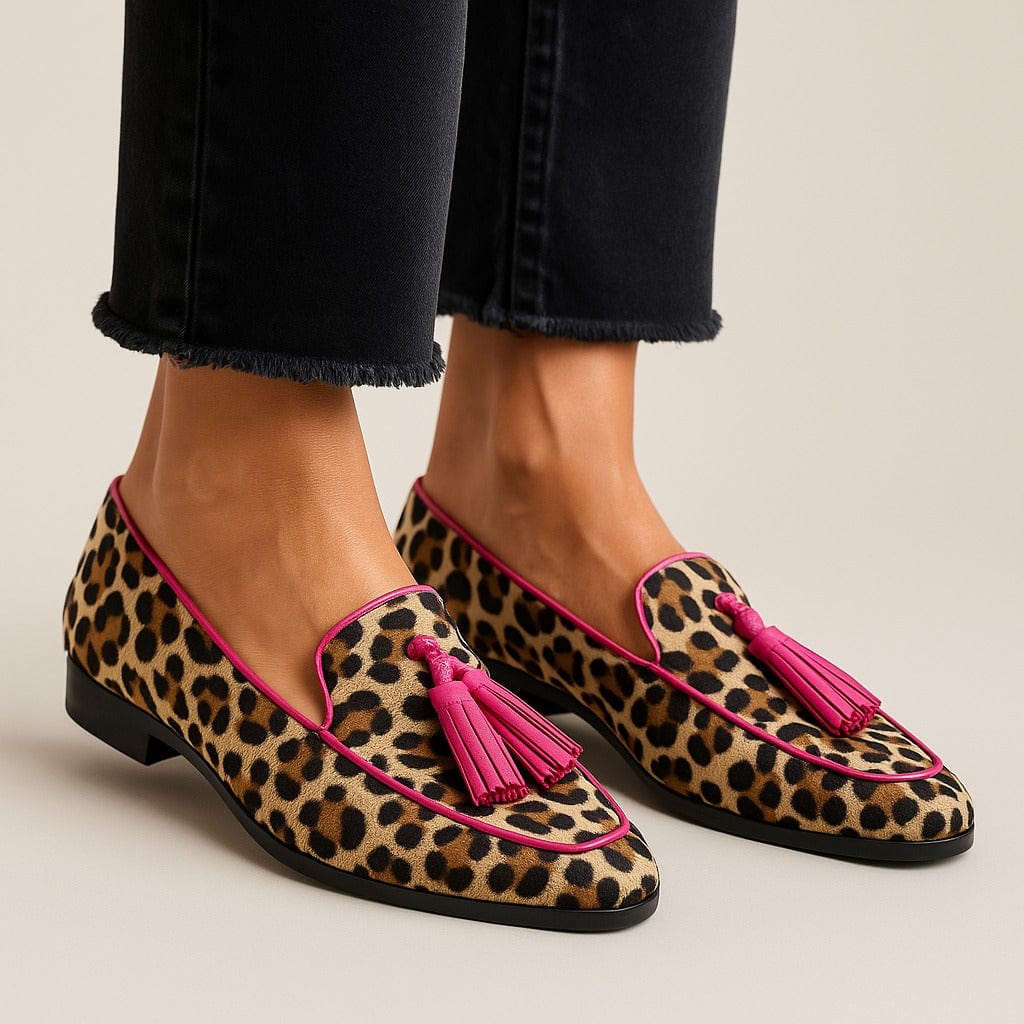 Animal print fringe tassel loafers in leopard print with pink tassel accent, side view
