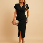 V-neck wrap bodycon midi dress in black – side slit front view