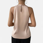 Women's pleated front draped satin top close-up of neckline detail