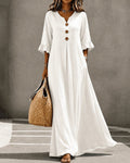 V-neck button ruffle full skirt maxi dress in white, front view