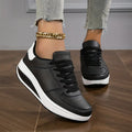 Black platform lace-up trainers, front view