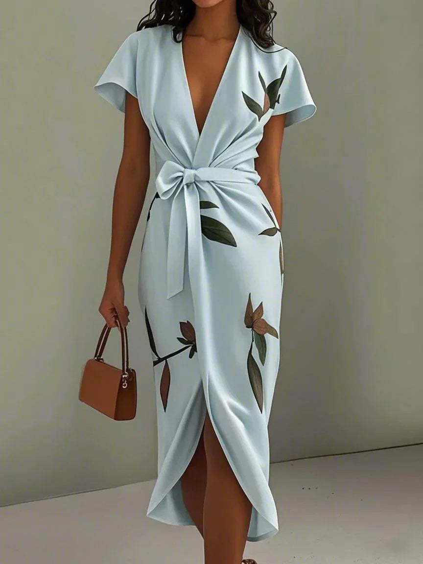 Women's leaf print wrap maxi dress, back view showing self-tie belt and flowing skirt